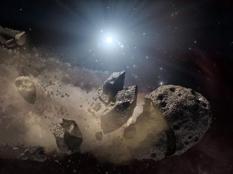 Dead star, or "white dwarf," surrounded by the bits and pieces of a disintegrating asteroid