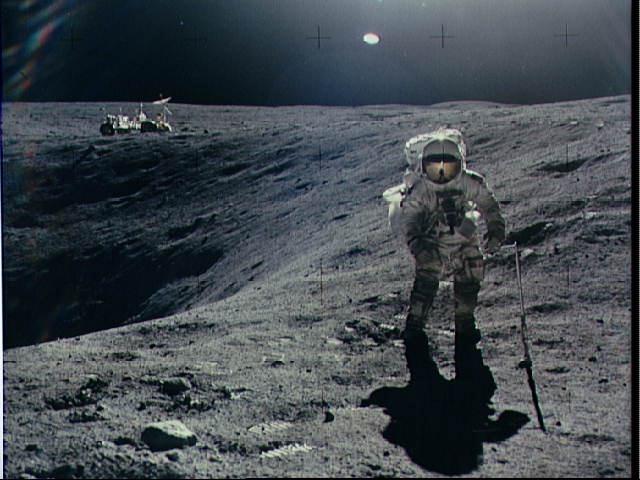 Apollo 16 Astronaut Charlie Young exploring Plum Crater on the Moon
