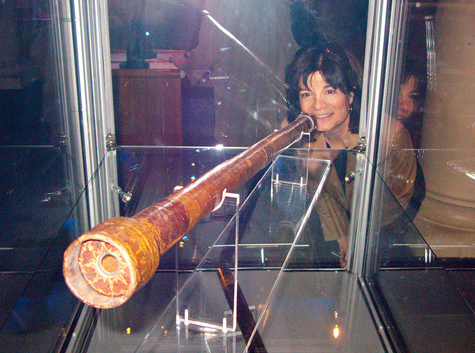 Photo of Carolyn Porco inspecting one of Galileo's telescopes in Stockholm, Sweden, 2009
