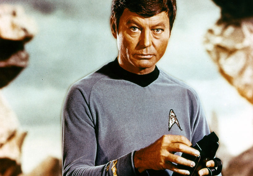 Photo of Leonard "Bones" McCoy with a tricorder. Image Credit: Paramount Home Television
