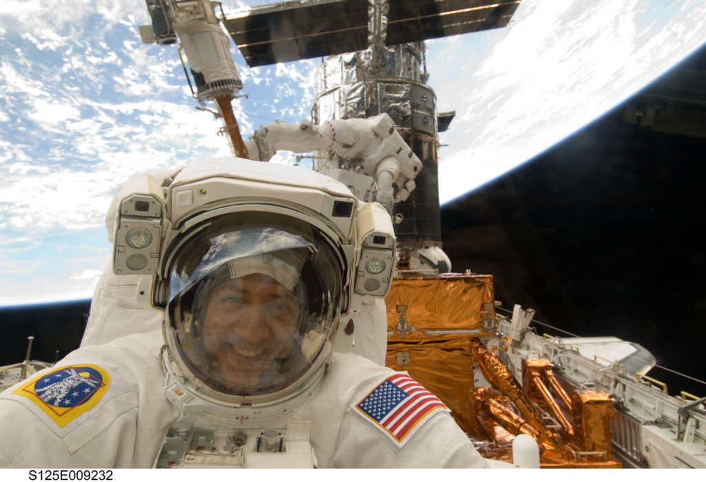 May 17, 2009 photo of Astronaut Mike Massimino repairing the Hubble Space Telescope on Space Shuttle mission STS-125.