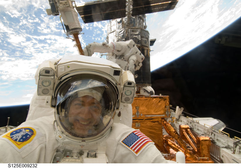 May 17, 2009 photo of Astronaut Mike Massimino repairing the Hubble Space Telescope on Space Shuttle mission STS-125.