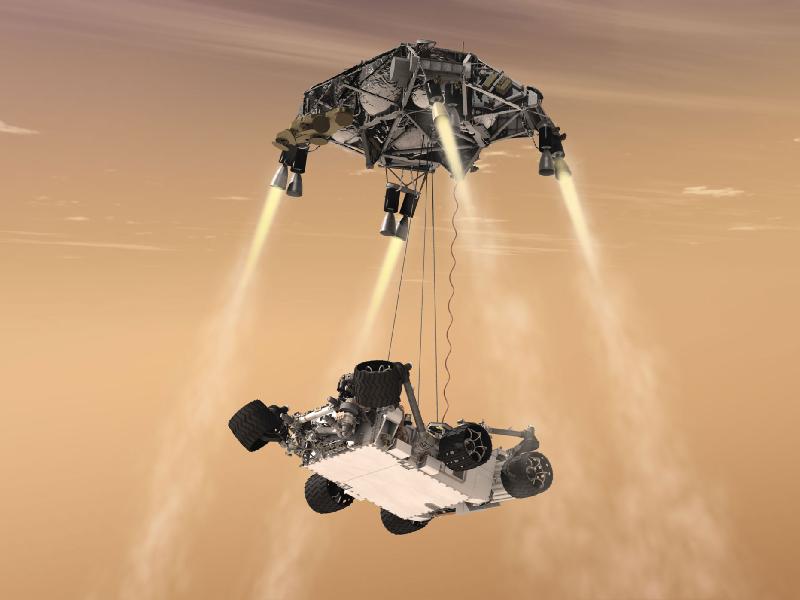 Artist's concept of Curiosity being lowered to the surface of Mars via the Sky Crane Maneuver. Credit: NASA-JPL