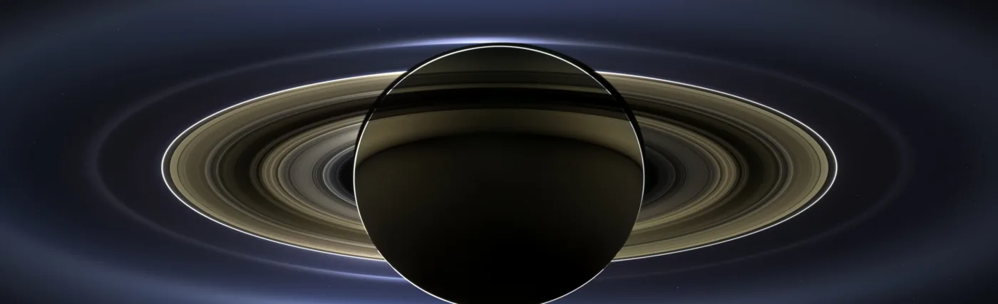 "The Day the Earth Smiled" - a photo of the planet Saturn, with Earth in the very distant background, taken by Cassini. Credit: NASA/JPL-Caltech/SSI.