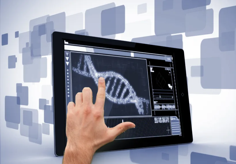 Man pointing at DNA interface on digital tablet