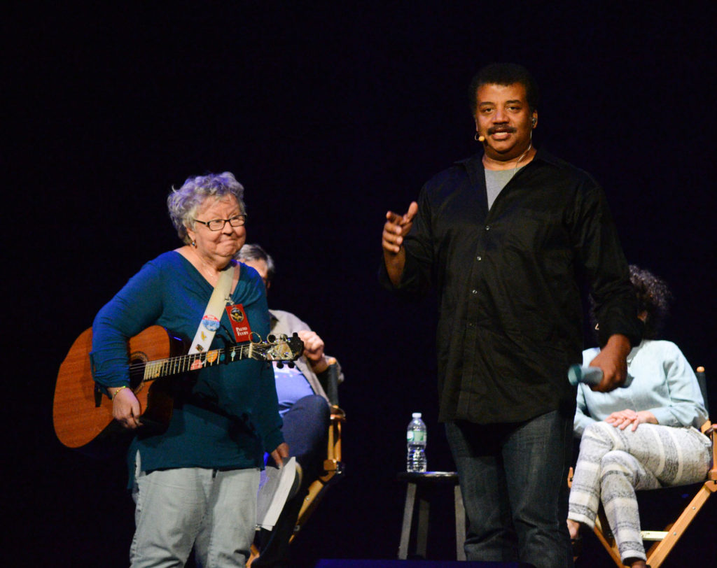 Photo by Elliot Severn of Christine Lavin and Neil deGrasse Tyson on stage at StarTalk Live! at the Beacon Theatre in NYC on 9/21/15.