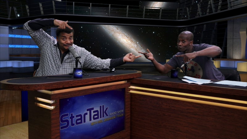 Photo of astrophysicist Neil deGrasse Tyson and comic co-host Godfrey in the StarTalk studio.