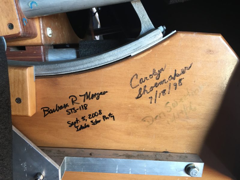 Photo showing Signatures of Barbara Morgan and Carolyn Shoemaker on the telescope at Bruneau Sand Dunes State Park Observatory.