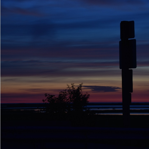 Ted Shevlin's photo showing sunrise on the causeway, road signs and all.