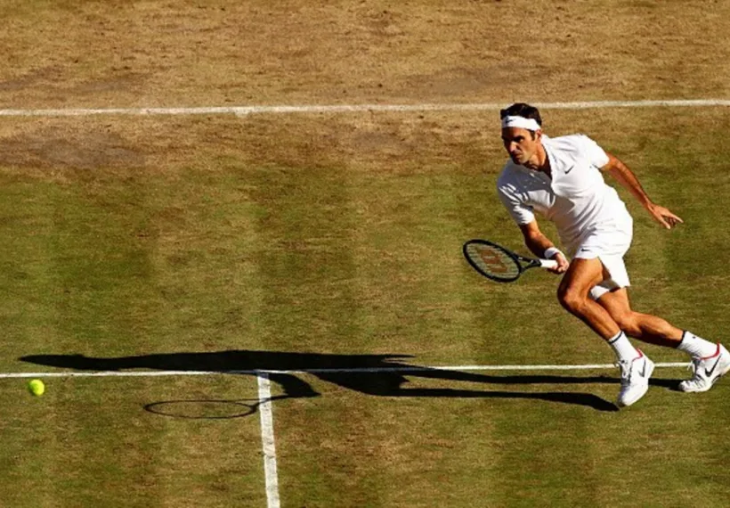 Photo of Roger Federer returning a shot, courtesy of Wilson.com