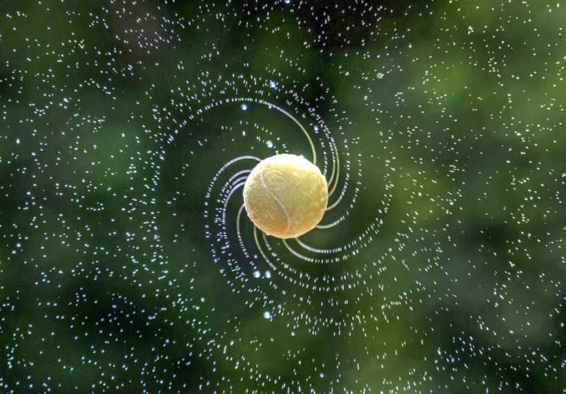 Photo of tennis ball showing spin. Credit: Zyteng-Photography/iStock.