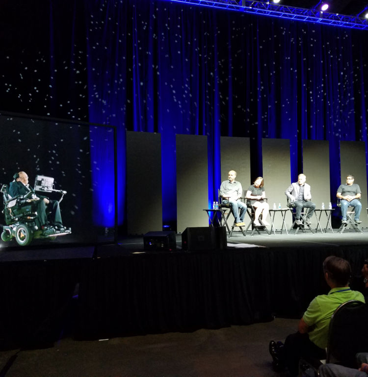 Stacey Severn’s photo of StarTalk Live! from FutureCon, showing holographic Stephen Hawking, Scott Adsit, Katherine Pratt, Chris Hadfield, Suveen Mathaudu, and Maeve Higgins