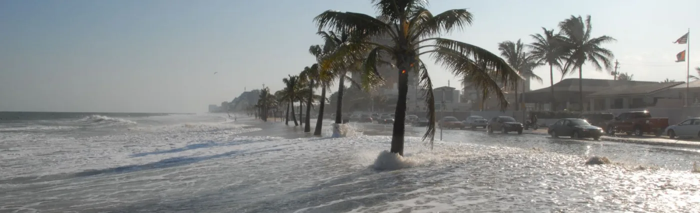 Photo of water overflowing shore depicting rising sea levels, from Dave/Flickr/Creative Commons/CC BY 2.0, via NASA.gov.