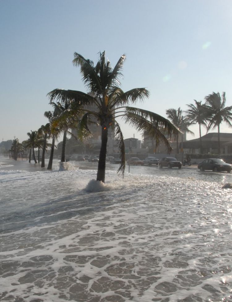 Photo of water overflowing shore depicting rising sea levels, from Dave/Flickr/Creative Commons/CC BY 2.0, via NASA.gov.
