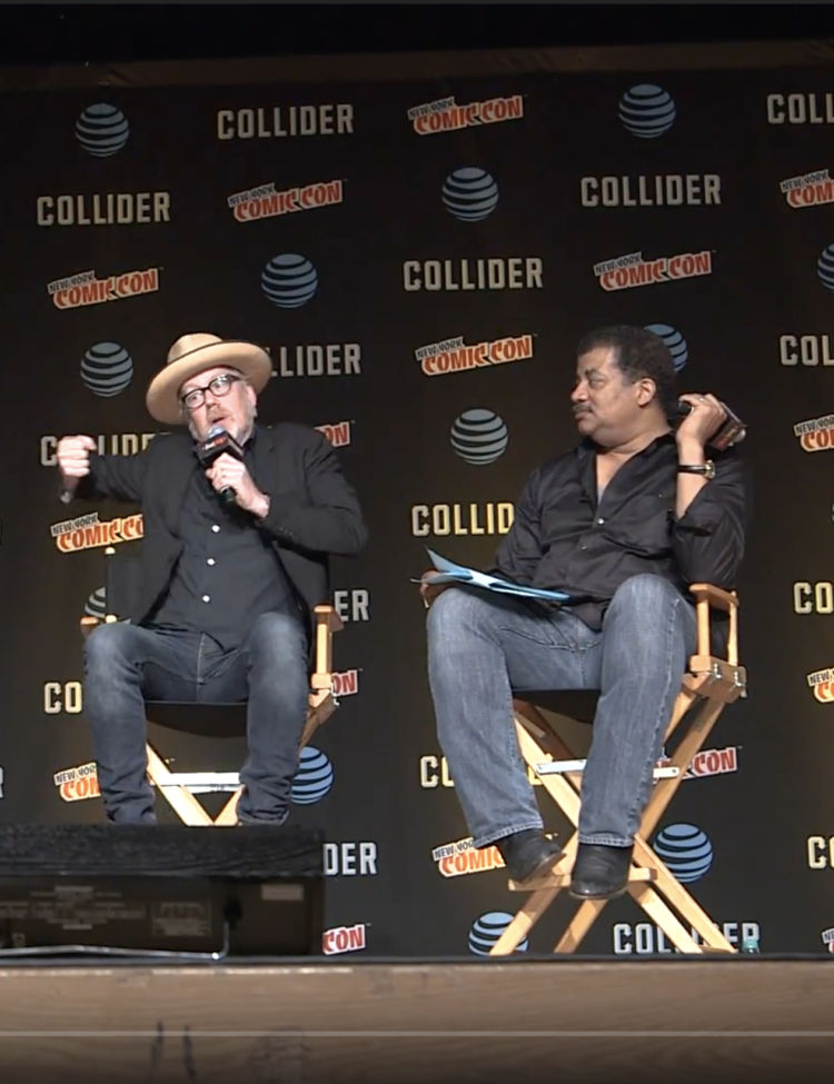 Photo from the main stage at NYCC 2017 showing, left to right, Chuck Nice, Matthew Liao, Adam Savage, and Neil deGrasse Tyson.