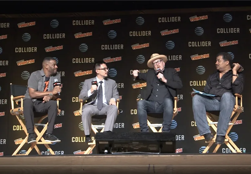 Photo from the main stage at NYCC 2017 showing, left to right, Chuck Nice, Matthew Liao, Adam Savage, and Neil deGrasse Tyson.