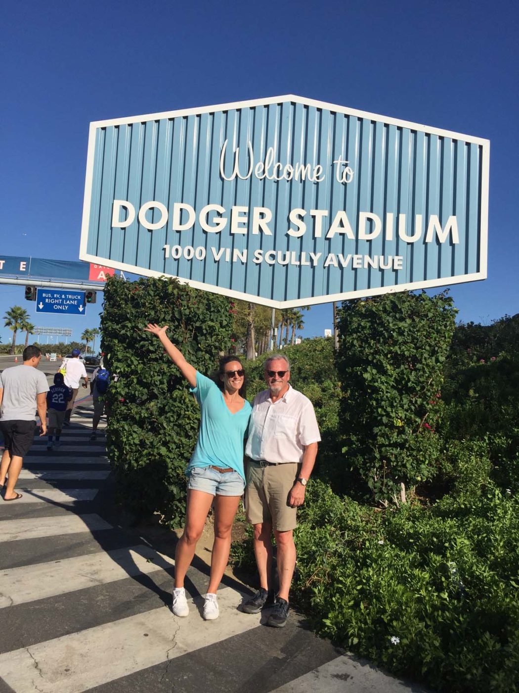 Jessica Stacy's photo of herself and her dad in front of the Dodger Stadium sign for Playing with Science World Series blog post.