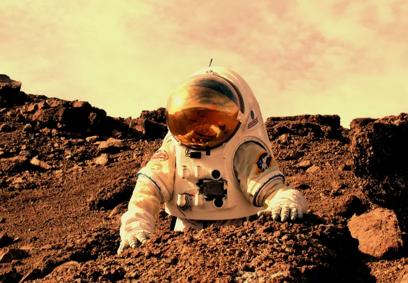 Image of an astronaut on Mars. Photo credit: NASA Haughton-Mars Project/Pascal Lee 010808-0013.