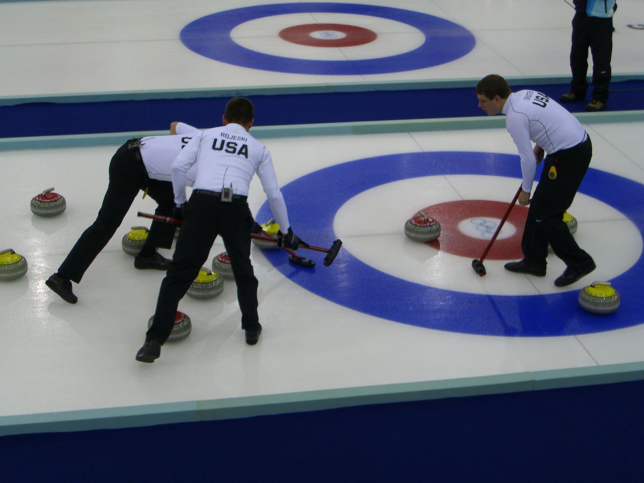 Photo of the US Men's Curling team at the 2006 Winter Olympics in Turin, Italy, taken by Feddar (Own work) [Public domain], via Wikimedia Commons.