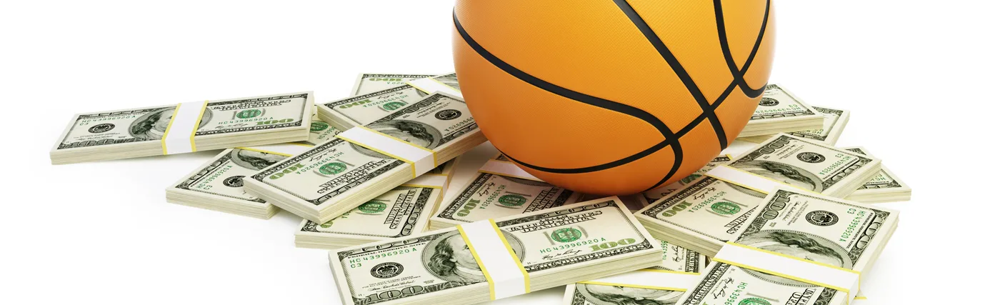 Photo of basketball and money for Playing with Science podcast, NCAA March Madness, Money and Minds. Credit: 3dfoto/iStock.