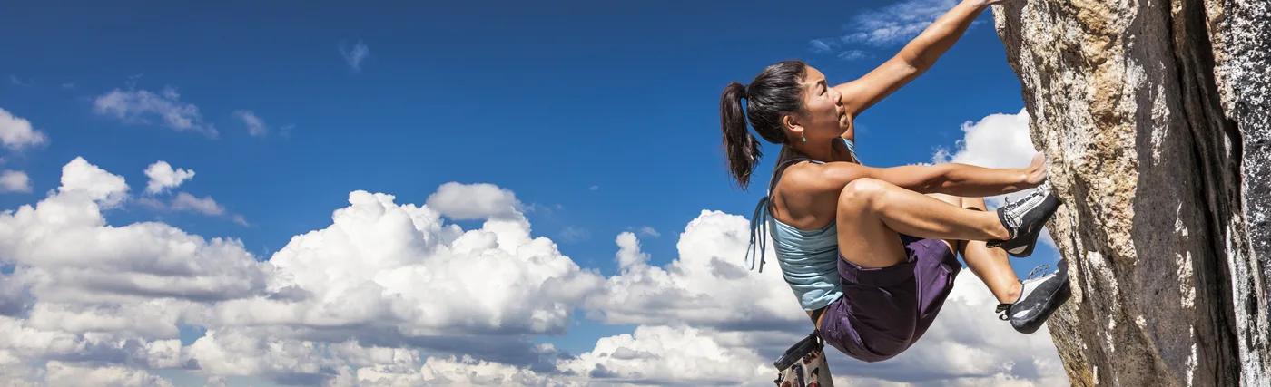 Photo of an extreme sport athlete climbing a mountain. Credit_gregepperson_iStock.