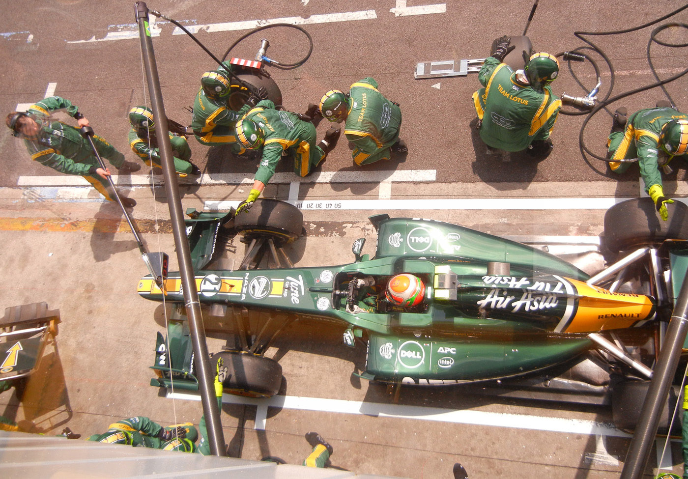 Photo by Dell Inc. of Team Lotus car in the pit lane during the race) [CC BY 2.0 (https://creativecommons.org/licenses/by/2.0)], via Wikimedia Commons.