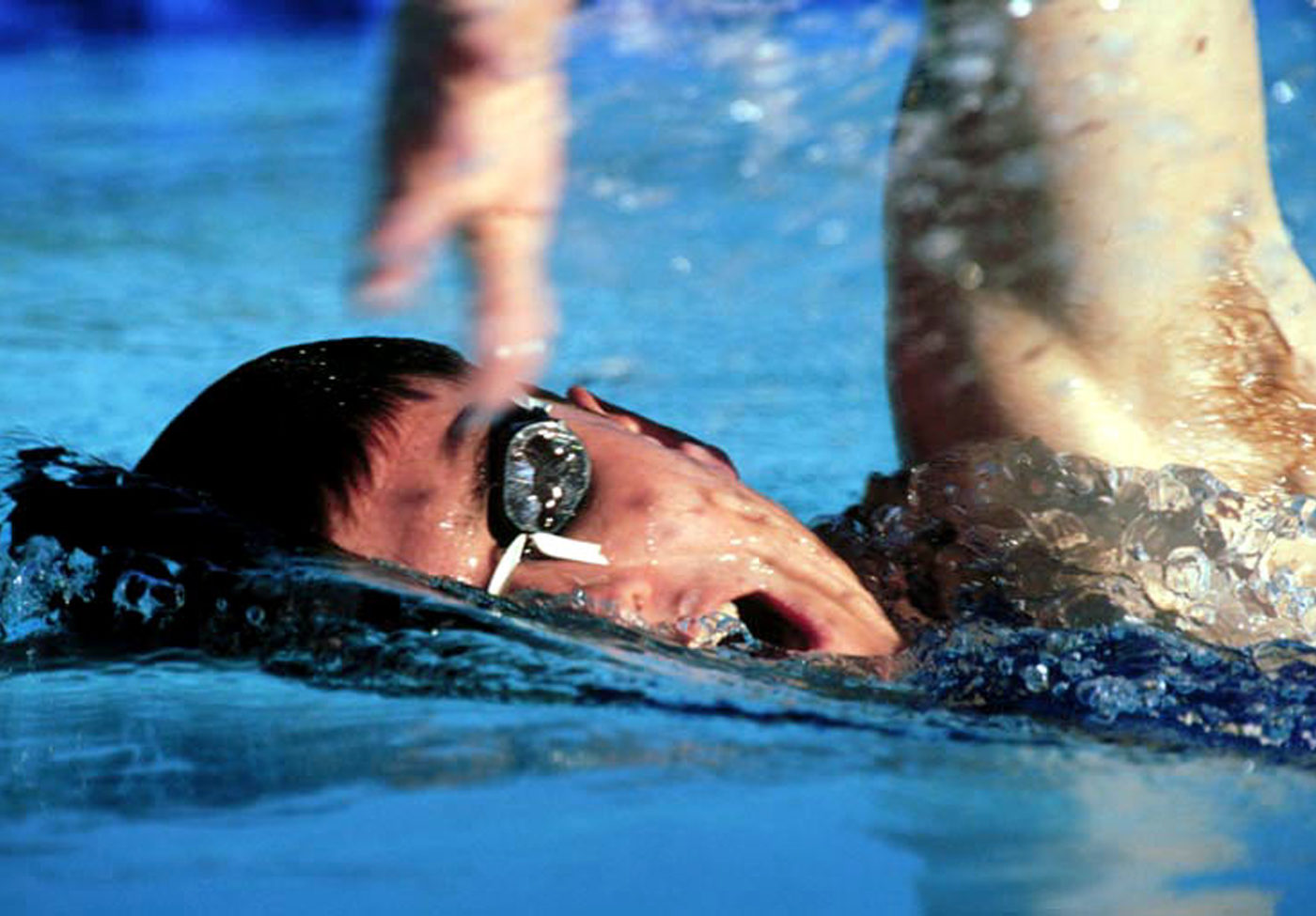 A public domain close-up photo of a swimmer from Wikimedia Commons.