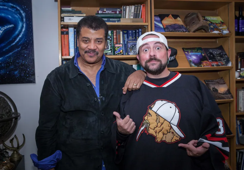 Brandon Royal’s photo of Neil deGrasse Tyson and Kevin Smith in Neil’s office at the Hayden Planetarium.