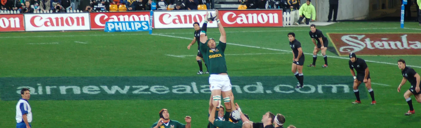 Hamish McConnochie’s photo of South African Victor Matfield taking a line-out against New Zealand in 2006, via Wikimedia Commons.