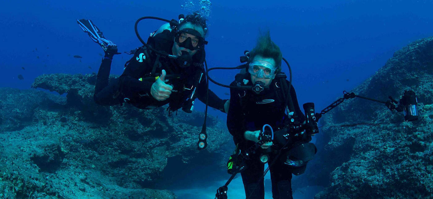 Dr. Sylvia Earle and marine artist Wyland share their first dive together at Midway Atoll National Wildlife Refuge. Photo credit: Amanda Meyer/USFWS