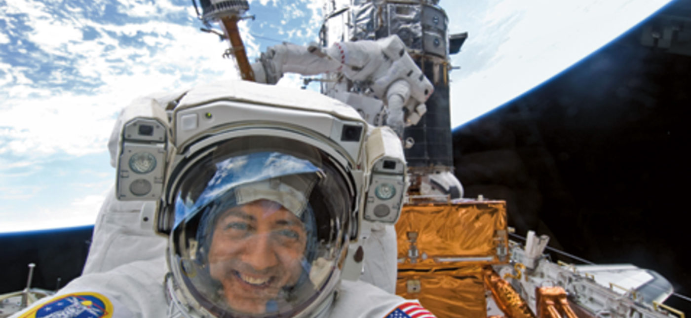 NASA photo of Astronaut Mike Massimino smiles for the camera during STS-125, the last Hubble Servicing mission in May 2009.