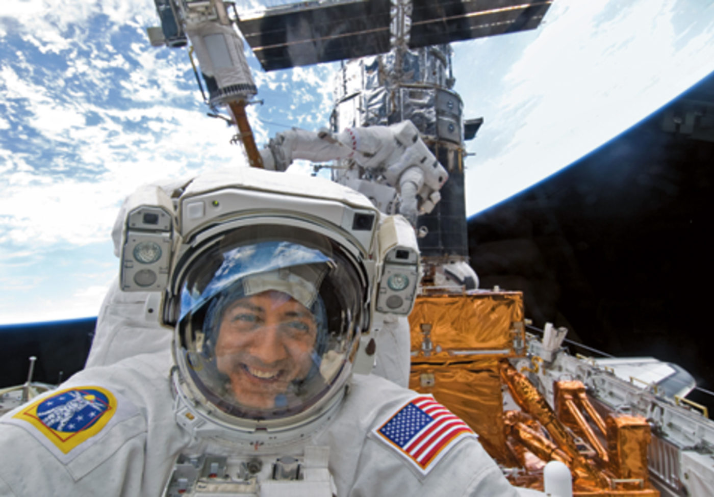 NASA photo of Astronaut Mike Massimino smiles for the camera during STS-125, the last Hubble Servicing mission in May 2009.