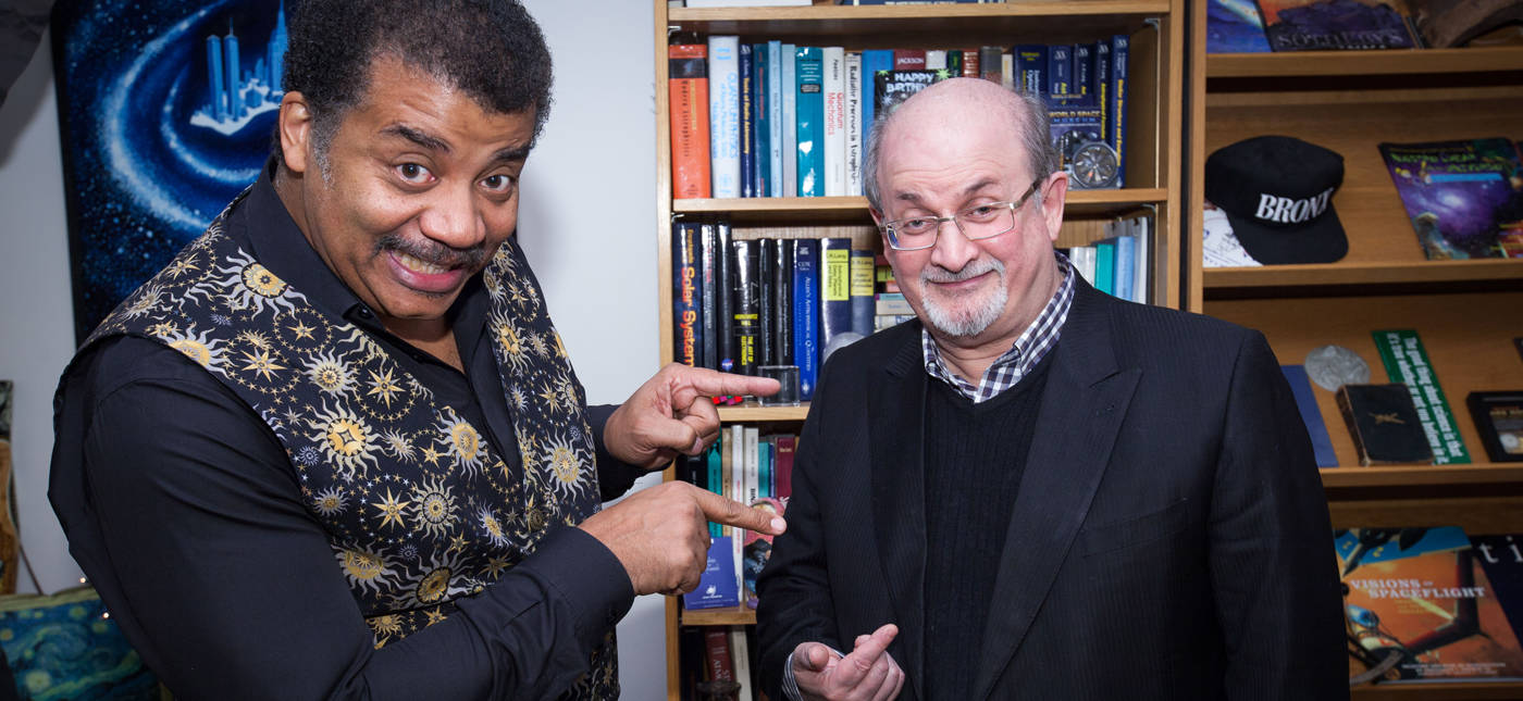Brandon Royal’s photo of Neil deGrasse Tyson and Salman Rushdie in Neil deGrasse Tyson’s office at the Hayden Planetarium at the American Museum of Natural history.