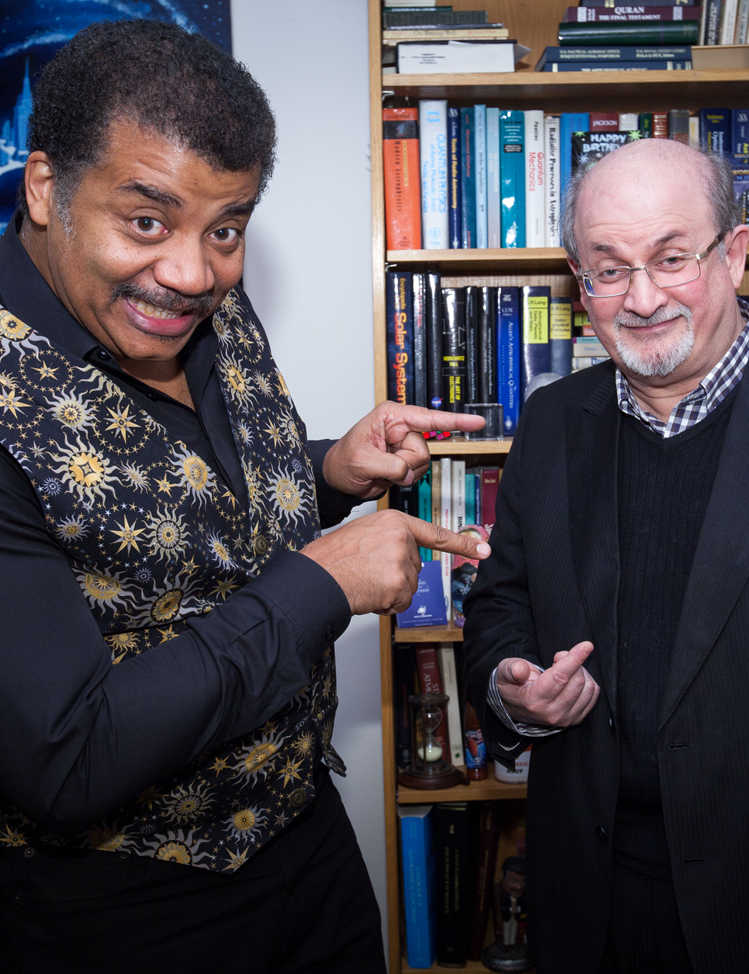Brandon Royal’s photo of Neil deGrasse Tyson and Salman Rushdie in Neil deGrasse Tyson’s office at the Hayden Planetarium at the American Museum of Natural history.