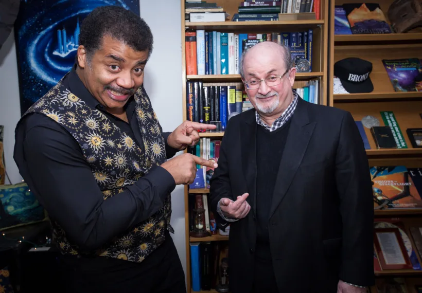Brandon Royal’s photo of Neil deGrasse Tyson and Salman Rushdie in Neil deGrasse Tyson’s office at the Hayden Planetarium at the American Museum of Natural history.