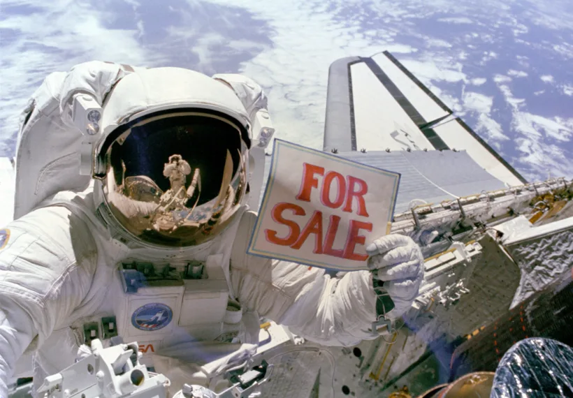 Astronaut Dale A. Gardner photographed over the Space Shuttle Discovery 11/14/84 by Joseph P. Allen IV, who can be seen in Gardner’s visor. Credit: NASA.