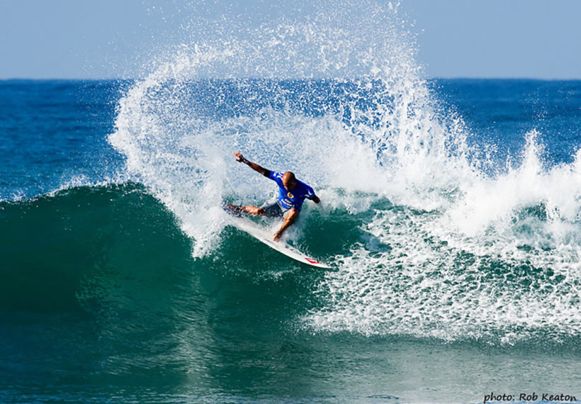 Rob Keaton’s photo of Kelly Slater riding a wave, via Wikimedia Commons.