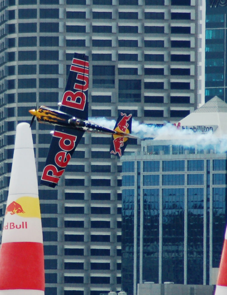 Photo of Kirby Chambliss, performing a "knife edge" maneuver in his Edge 540 in Perth, Western Australia during the final leg of the 2006 series. Credit: Myself (Hamish) [CC BY 2.0 (https://creativecommons.org/licenses/by/2.0)], via Wikimedia Commons.