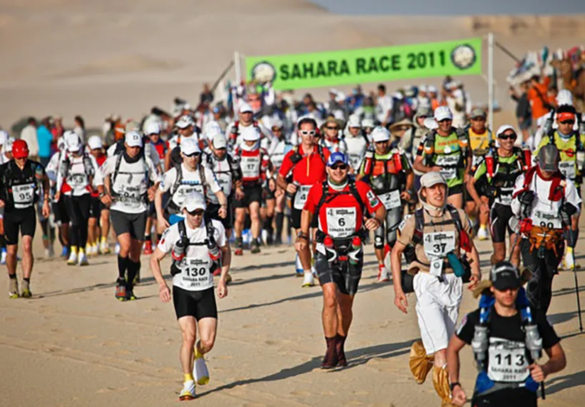 Photo of Ultramarathoners competing at the Sahara Race 2011. Photo Credit: John Doe, from Wikimedia Commons.