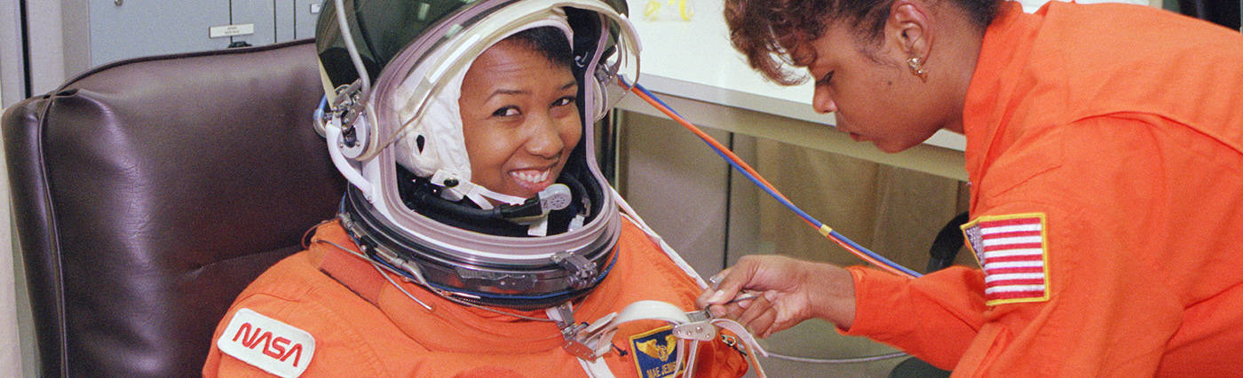 NASA photo of astronaut Mae Jemison suiting up for her historic space shuttle flight, NASA’s first by an African-American woman or woman of color.