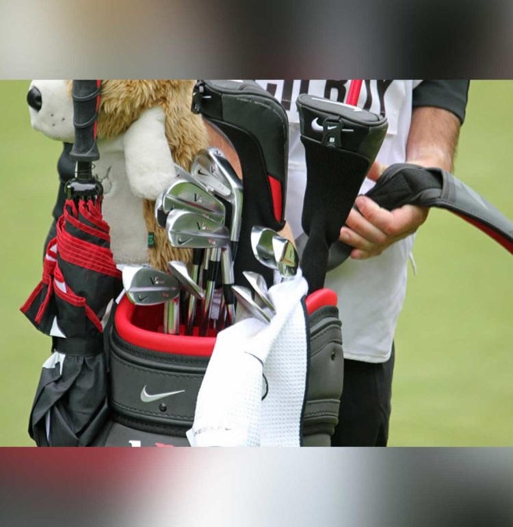 Rory McIlroy’s club bag and caddie. Credit: TourProGolfClubs [CC BY 2.0 (https://creativecommons.org/licenses/by/2.0)]