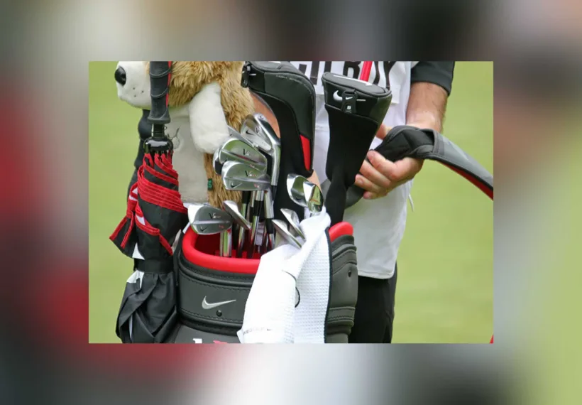 Rory McIlroy’s club bag and caddie. Credit: TourProGolfClubs [CC BY 2.0 (https://creativecommons.org/licenses/by/2.0)]