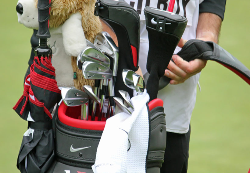 Rory McIlroy’s club bag and caddie. Credit: TourProGolfClubs [CC BY 2.0 (https://creativecommons.org/licenses/by/2.0)].