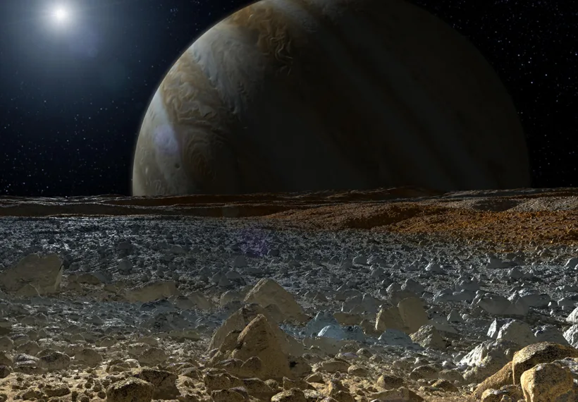 An Artist’s Rendering of Europa’s Surface as Jupiter Looms in the Background. Credit: NASA/JPL-Caltech.