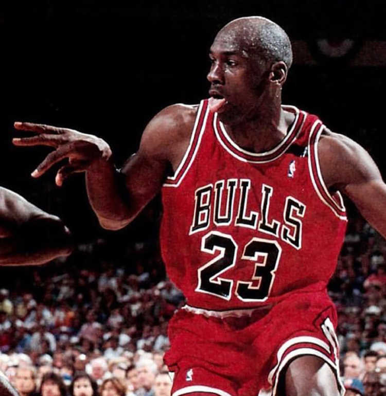 Michael Jordan dribbling on the court for the Chicago Bulls. Image Credit: Unknown author – Public domain.