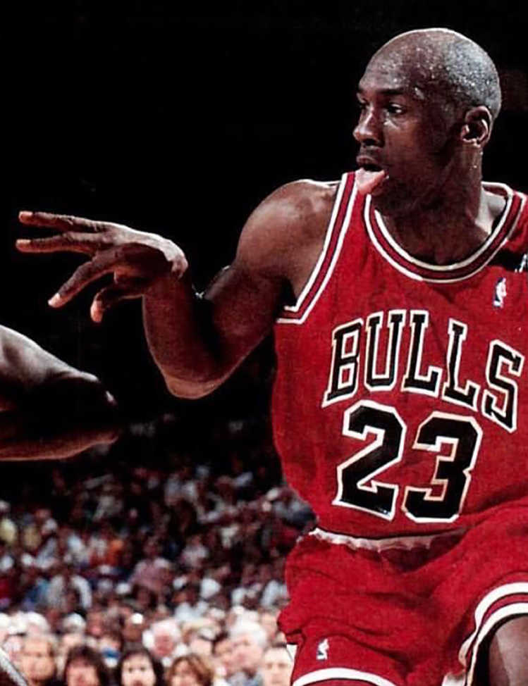 Michael Jordan dribbling on the court for the Chicago Bulls. Image Credit: Unknown author – Public domain.