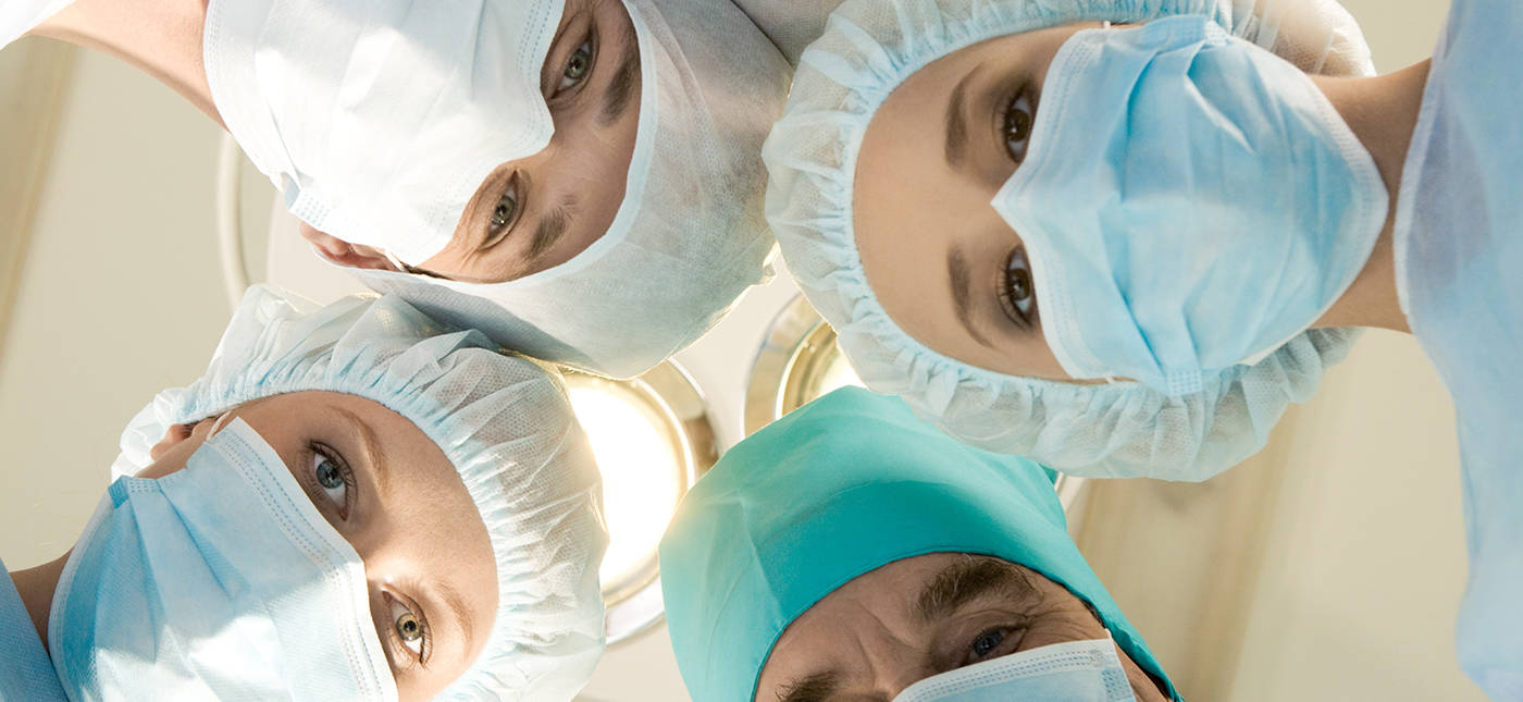 Storyblock’s image of masked medical professionals in a circle looking at camera.