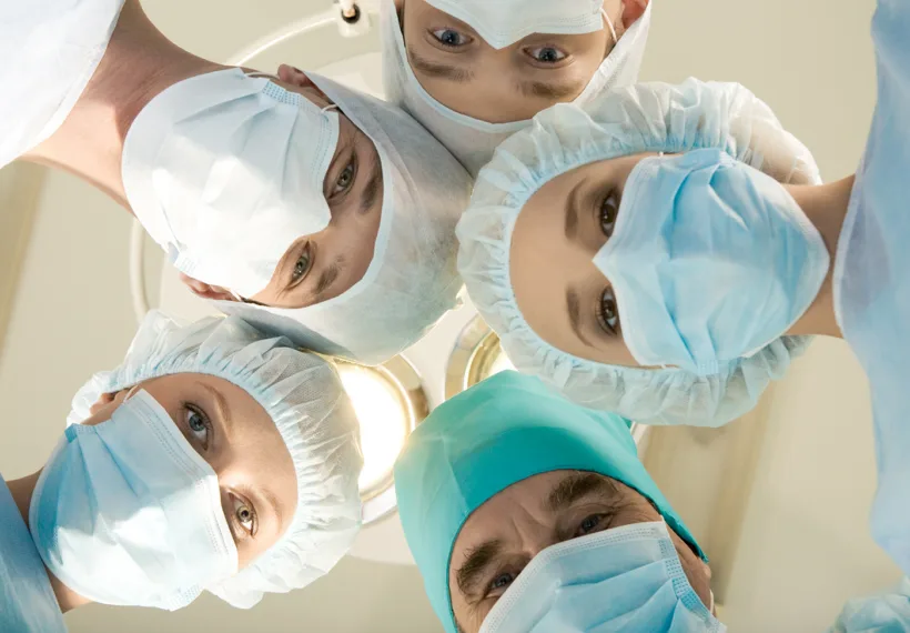 Storyblock’s image of masked medical professionals in a circle looking at camera.