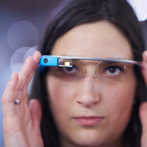 Storyblock’s image of a woman looking through tech glasses.