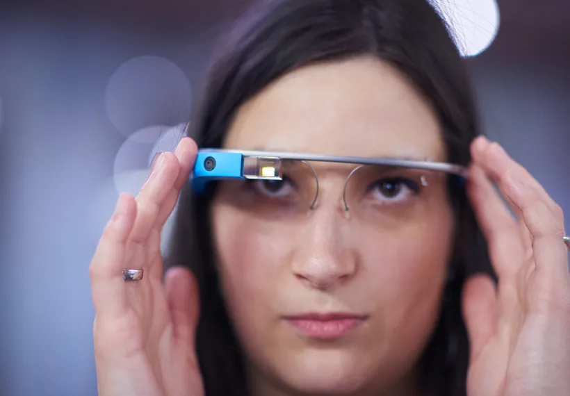 Storyblock’s image of a woman looking through tech glasses.